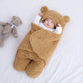 Baby quilted sleeping bag wrapper in cotton blend fabric showing colour options: white, red, grey, light blue, pink, khaki.