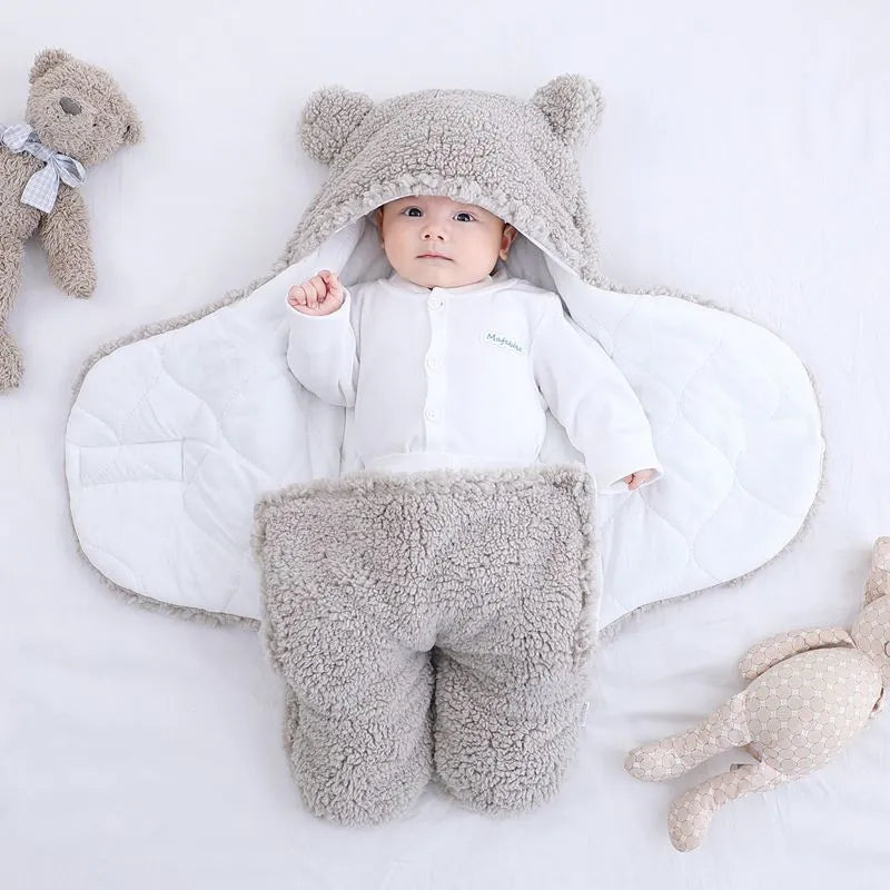 Baby quilted sleeping bag wrapper in cotton blend fabric showing colour options: white, red, grey, light blue, pink, khaki.