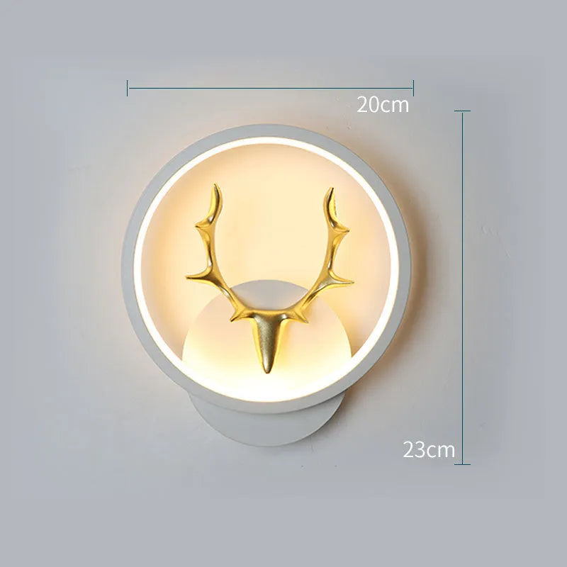 Deer antler wall lamp with remote control on wall showing three lighting colour options