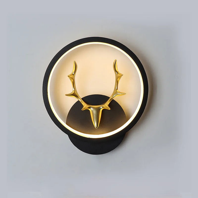 Deer antler wall lamp with remote control on wall showing three lighting colour options