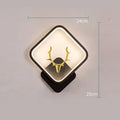 Deer antler wall lamp with remote control on wall showing three lighting colour options