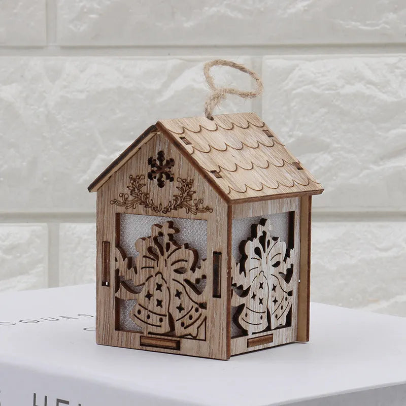 Three wooden Christmas decorations: a log bell, a Santa Claus house, and a snowman house on a festive background.