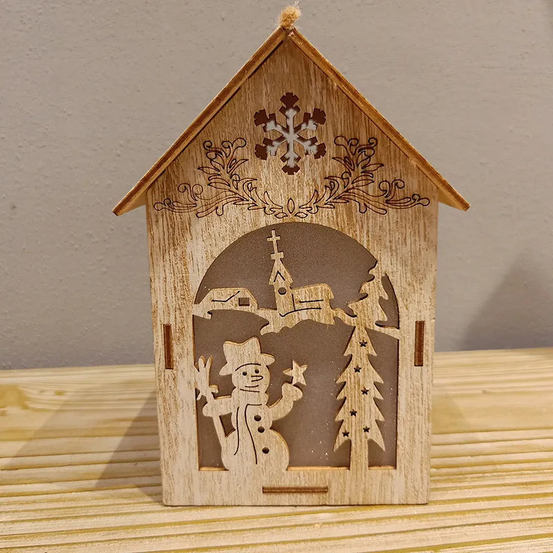 Three wooden Christmas decorations: a log bell, a Santa Claus house, and a snowman house on a festive background.