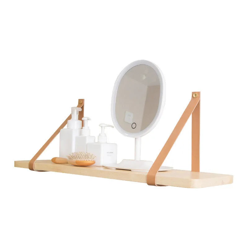 Pine wood wall-mounted storage shelf in a Nordic style, holding books and small items.