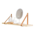 Pine wood wall-mounted storage shelf in a Nordic style, holding books and small items.