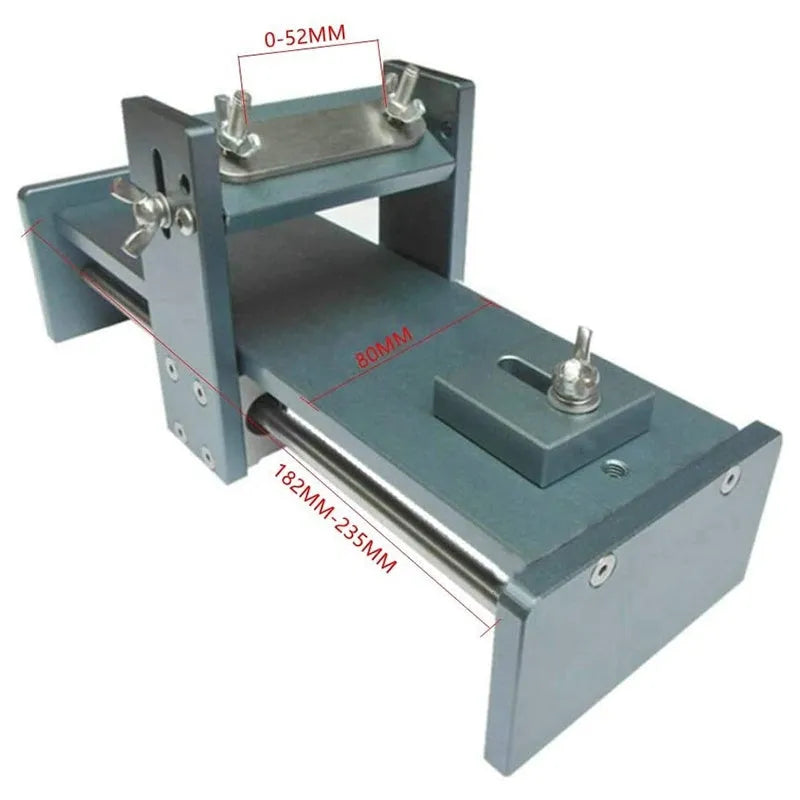 Aluminium alloy fixed angle sharpening tool for woodworking chisels and planers on a workshop bench.