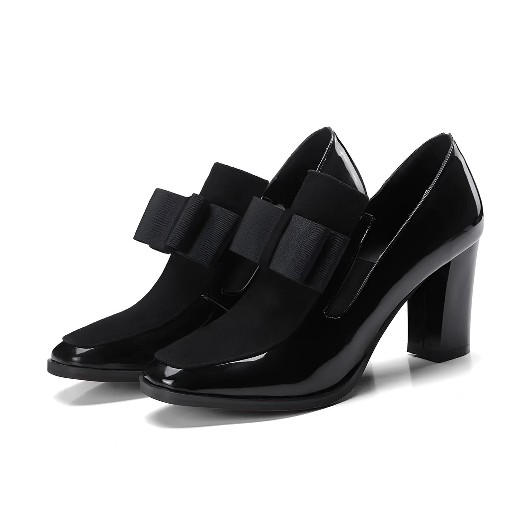 Women's black patent leather high heel with a thick square heel and rubber sole.