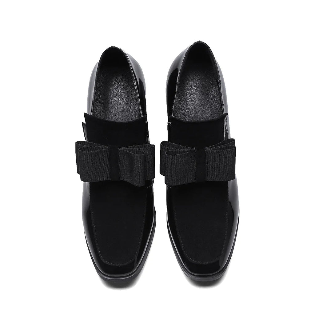Women's black patent leather high heel with a thick square heel and rubber sole.