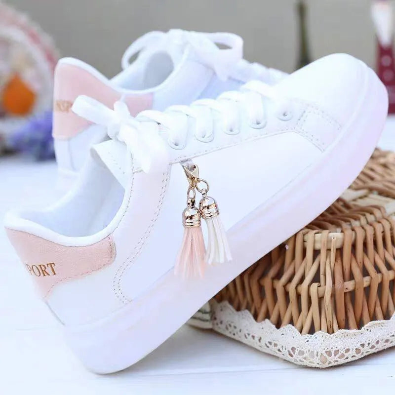White mesh flat casual shoes for women with rubber sole and breathable lining.