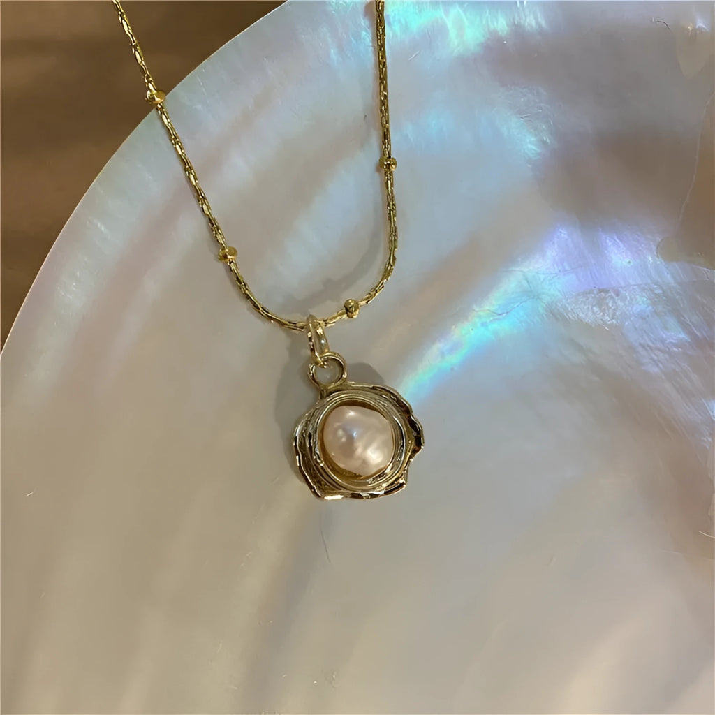Baroque freshwater pearl necklace with titanium steel golden chain on display