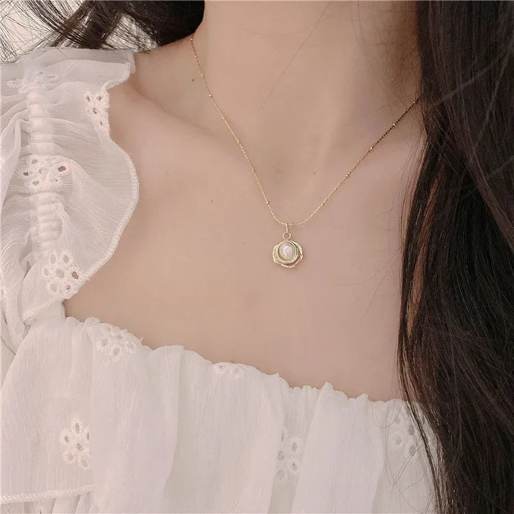 Baroque freshwater pearl necklace with titanium steel golden chain on display