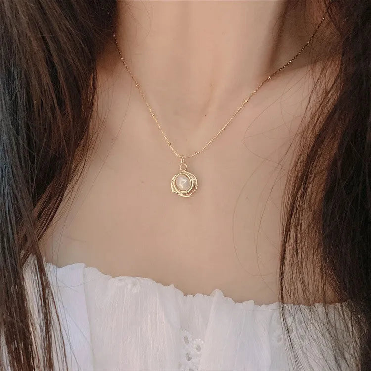 Baroque freshwater pearl necklace with titanium steel golden chain on display