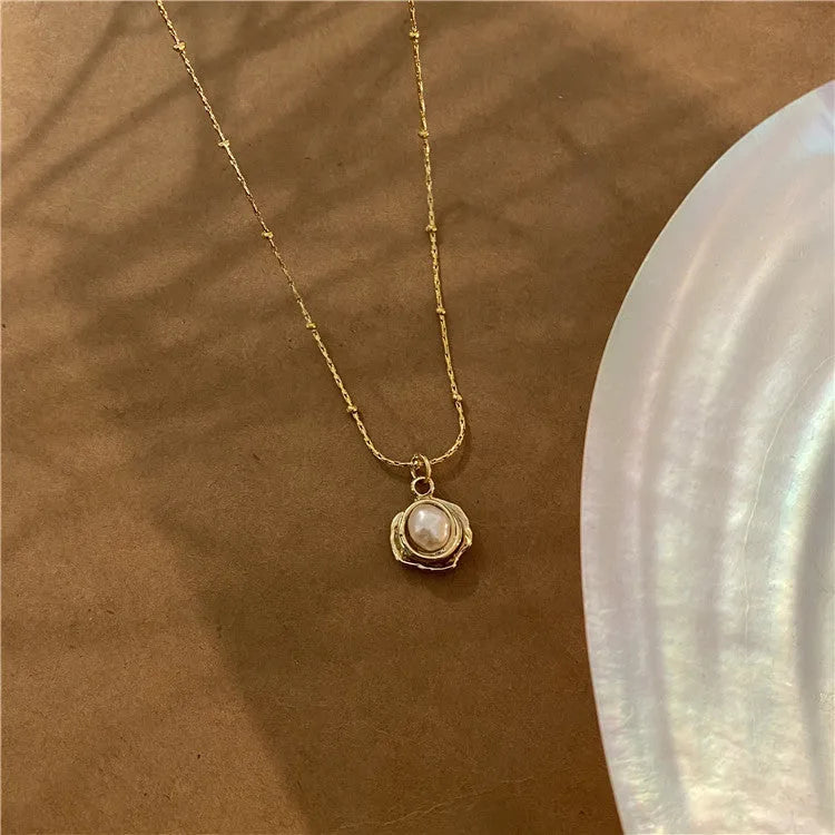 Baroque freshwater pearl necklace with titanium steel golden chain on display