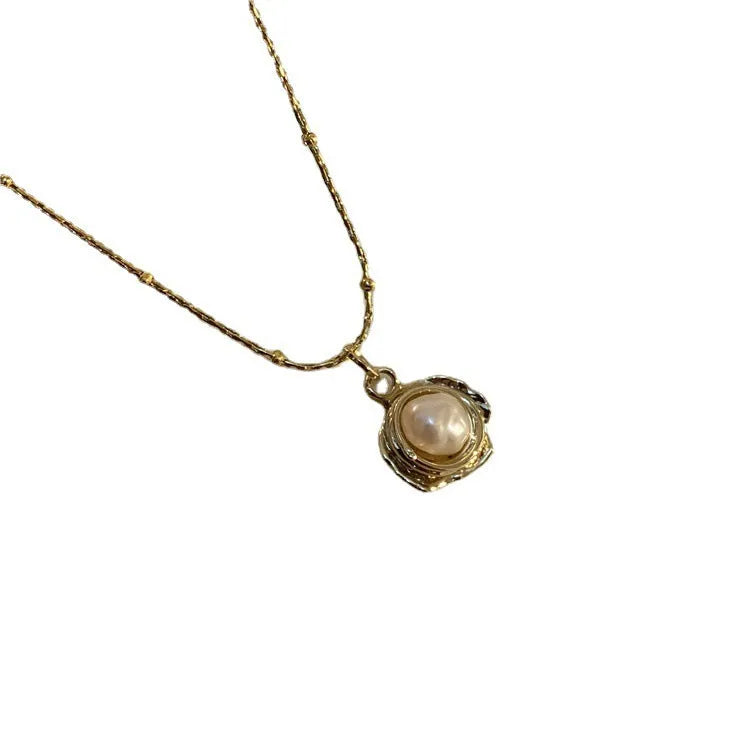 Baroque freshwater pearl necklace with titanium steel golden chain on display