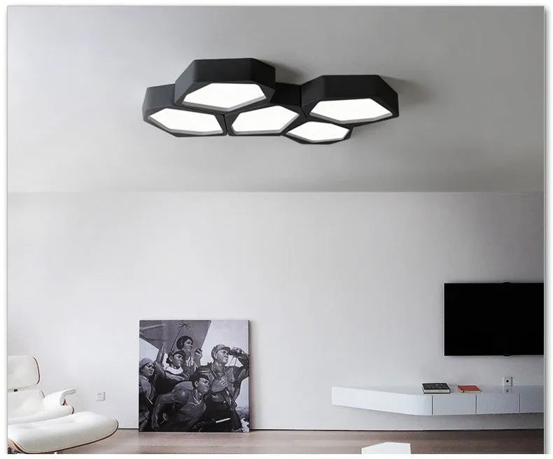 Geometric shaped iron wall light in black or white with remote control for adjustable LED lighting