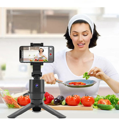 360-degree intelligent pan tilt tracking bracket holding a smartphone with AI face recognition activated.