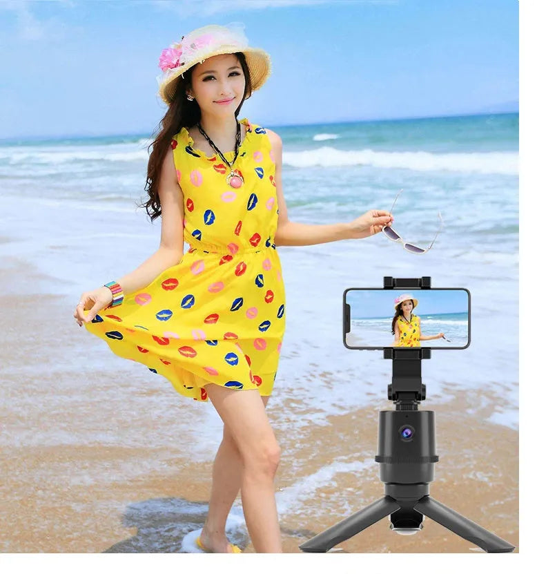 360-degree intelligent pan tilt tracking bracket holding a smartphone with AI face recognition activated.