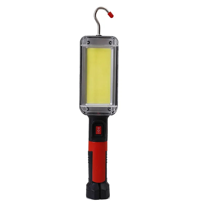 Red portable work light with magnetic base showing USB charging port and COB LED panel