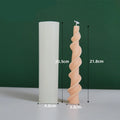 Handmade silicone candle mould with a spiral lace design for decorative wax candles.