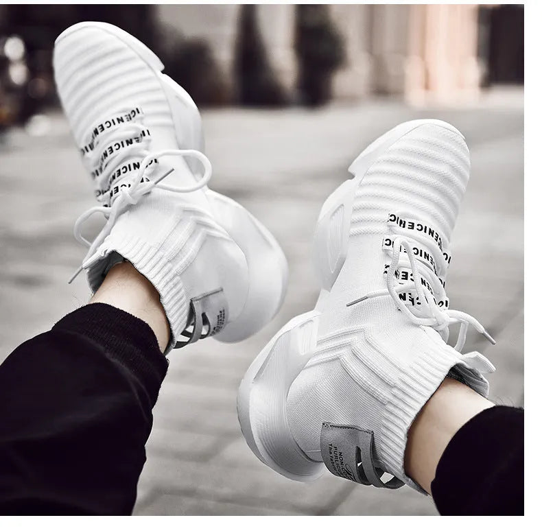 Men's black and white casual sports shoes with mesh lining, shown in large sizes.