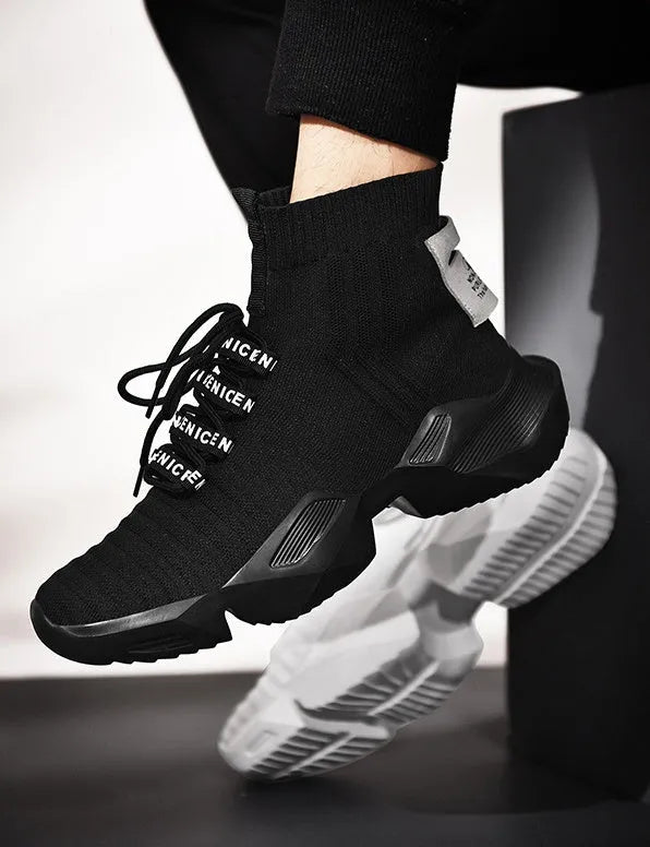 Men's black and white casual sports shoes with mesh lining, shown in large sizes.