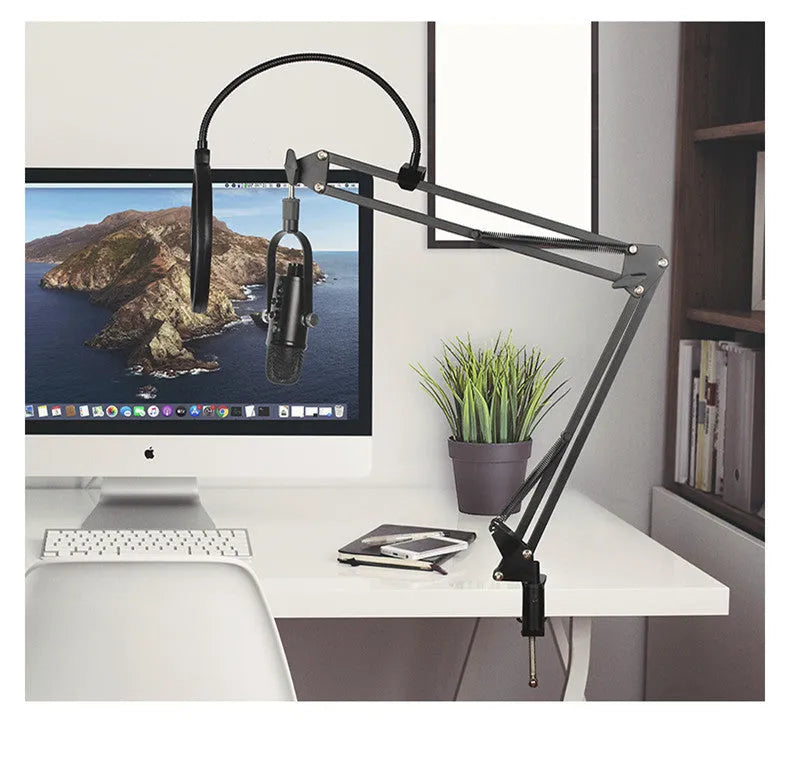 Black USB condenser microphone on metal stand with foam windscreen for desktop recording