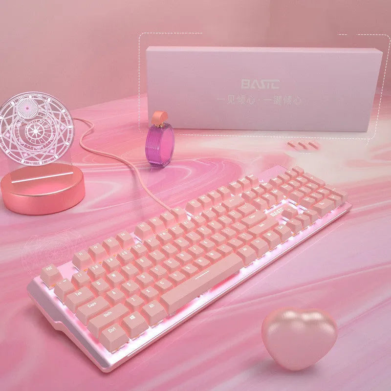 Pink wired mechanical keyboard and matching mouse set on a desk for E-sports gaming.