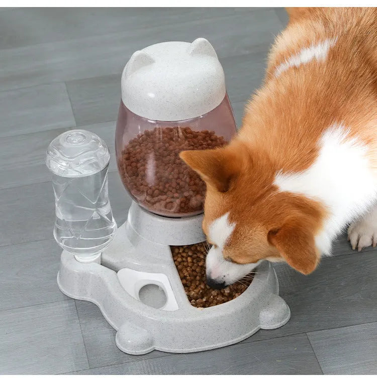 Automatic cat and dog food feeder with blue water dispenser and food tank on a wooden floor