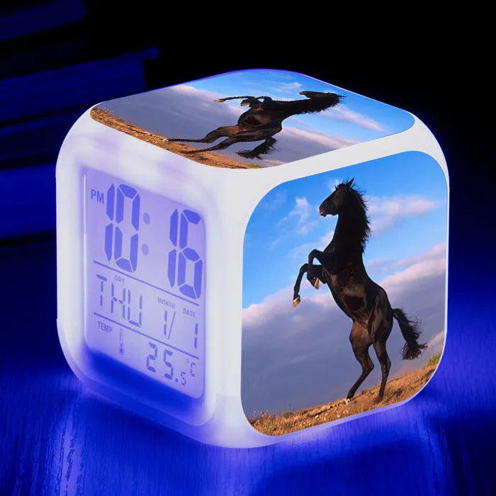 Small square LED alarm clock with colour changing display showing time and thermometer reading