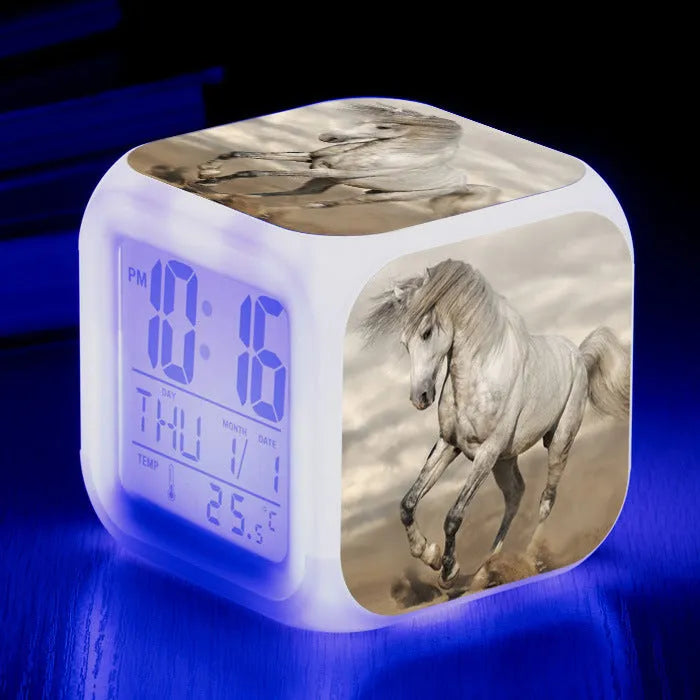 Small square LED alarm clock with colour changing display showing time and thermometer reading