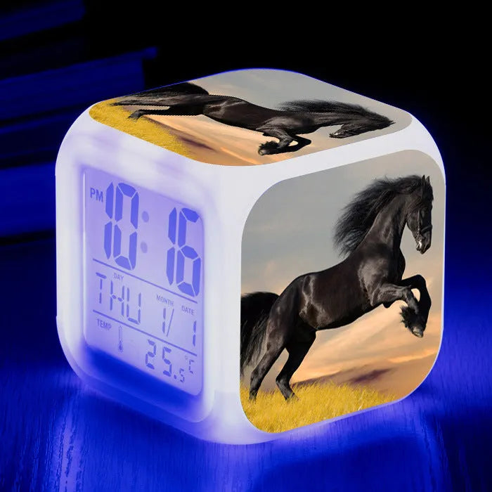 Small square LED alarm clock with colour changing display showing time and thermometer reading