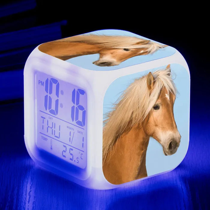 Small square LED alarm clock with colour changing display showing time and thermometer reading