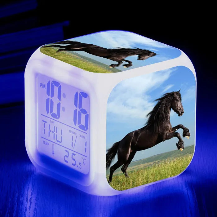 Small square LED alarm clock with colour changing display showing time and thermometer reading