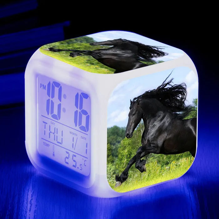 Small square LED alarm clock with colour changing display showing time and thermometer reading