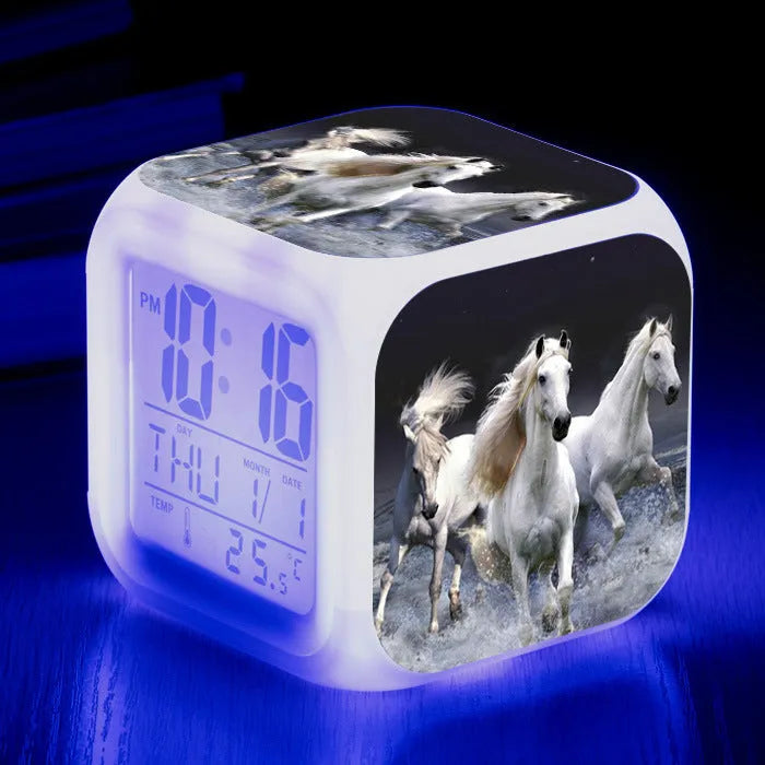 Small square LED alarm clock with colour changing display showing time and thermometer reading