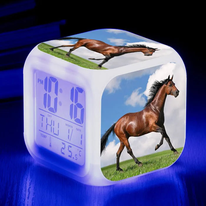Small square LED alarm clock with colour changing display showing time and thermometer reading