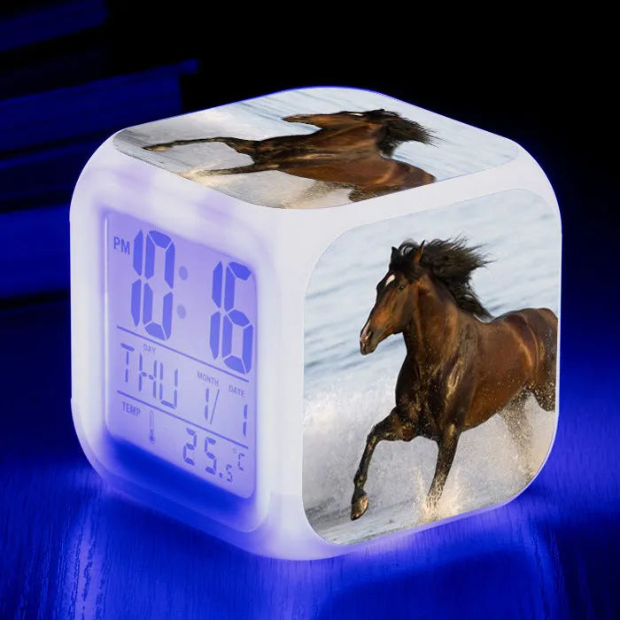 Small square LED alarm clock with colour changing display showing time and thermometer reading