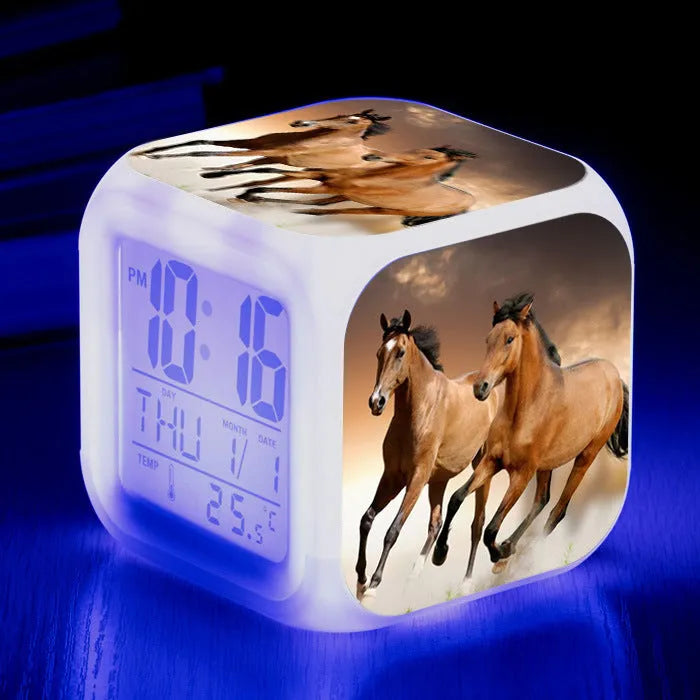 Small square LED alarm clock with colour changing display showing time and thermometer reading