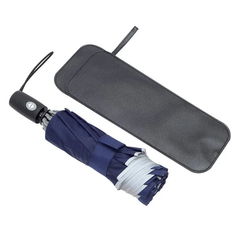 Black automatic reverse umbrella with folded canopy and non-slip plastic handle.