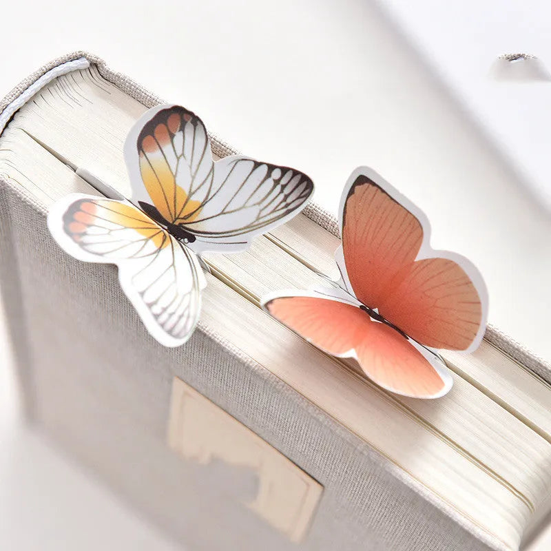 Butterfly-shaped paper bookmark measuring 13.5 by 5.5 centimetres