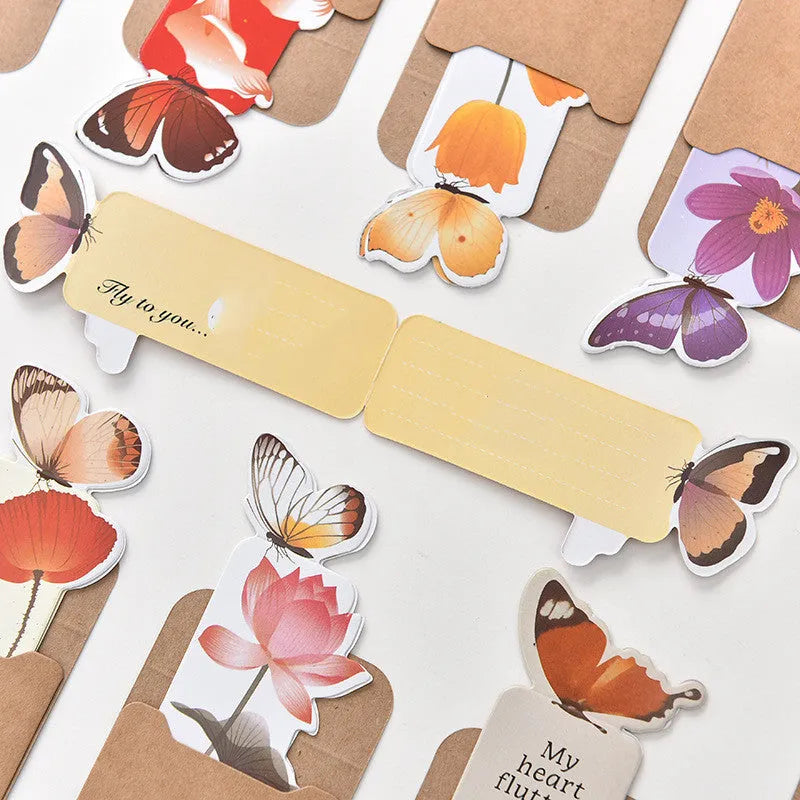 Butterfly-shaped paper bookmark measuring 13.5 by 5.5 centimetres