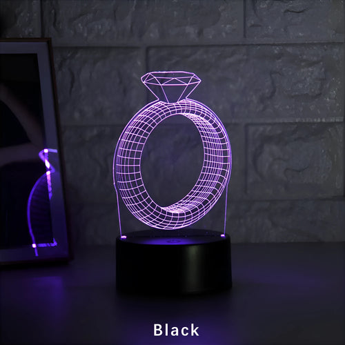 3D diamond ring LED night light with colour-changing modes on black background