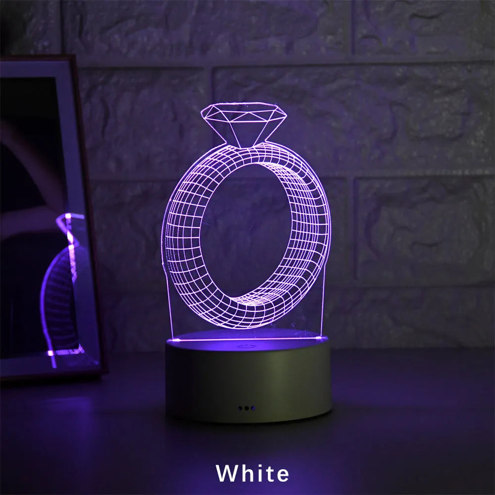 3D diamond ring LED night light with colour-changing modes on black background