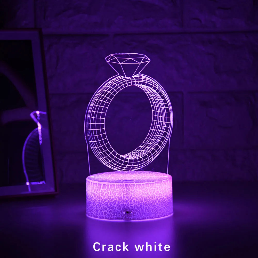 3D diamond ring LED night light with colour-changing modes on black background