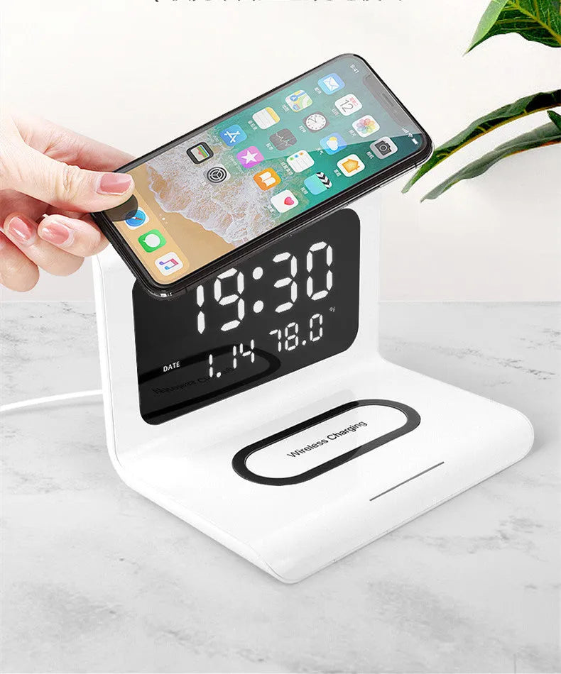 White wireless charger alarm clock showing time, calendar, temperature and humidity on LED display