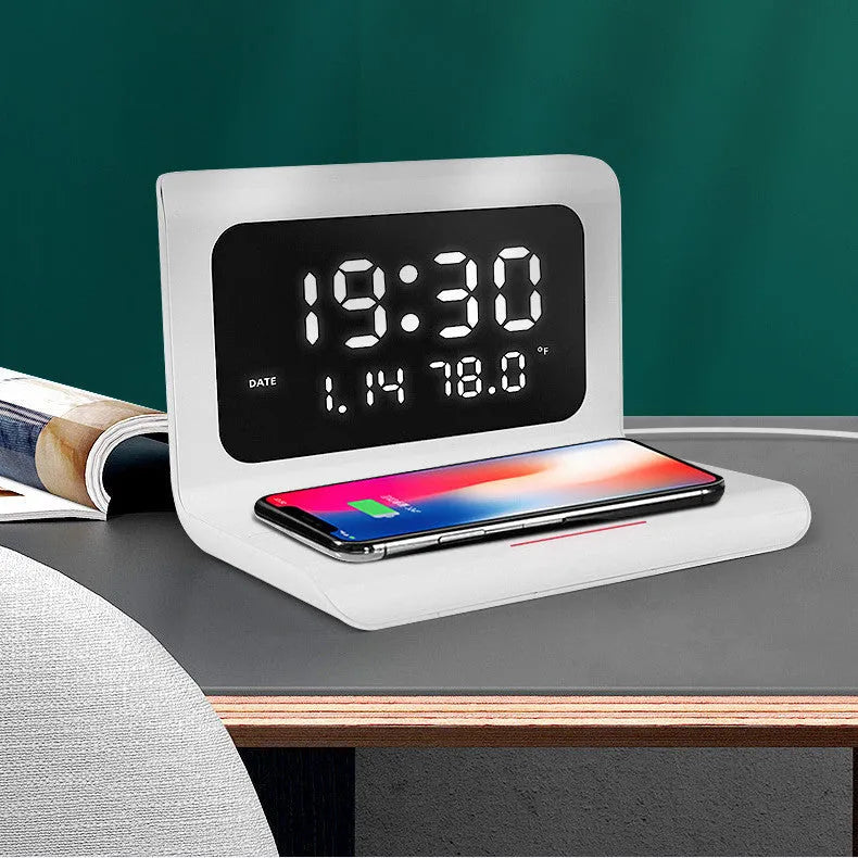 White wireless charger alarm clock showing time, calendar, temperature and humidity on LED display