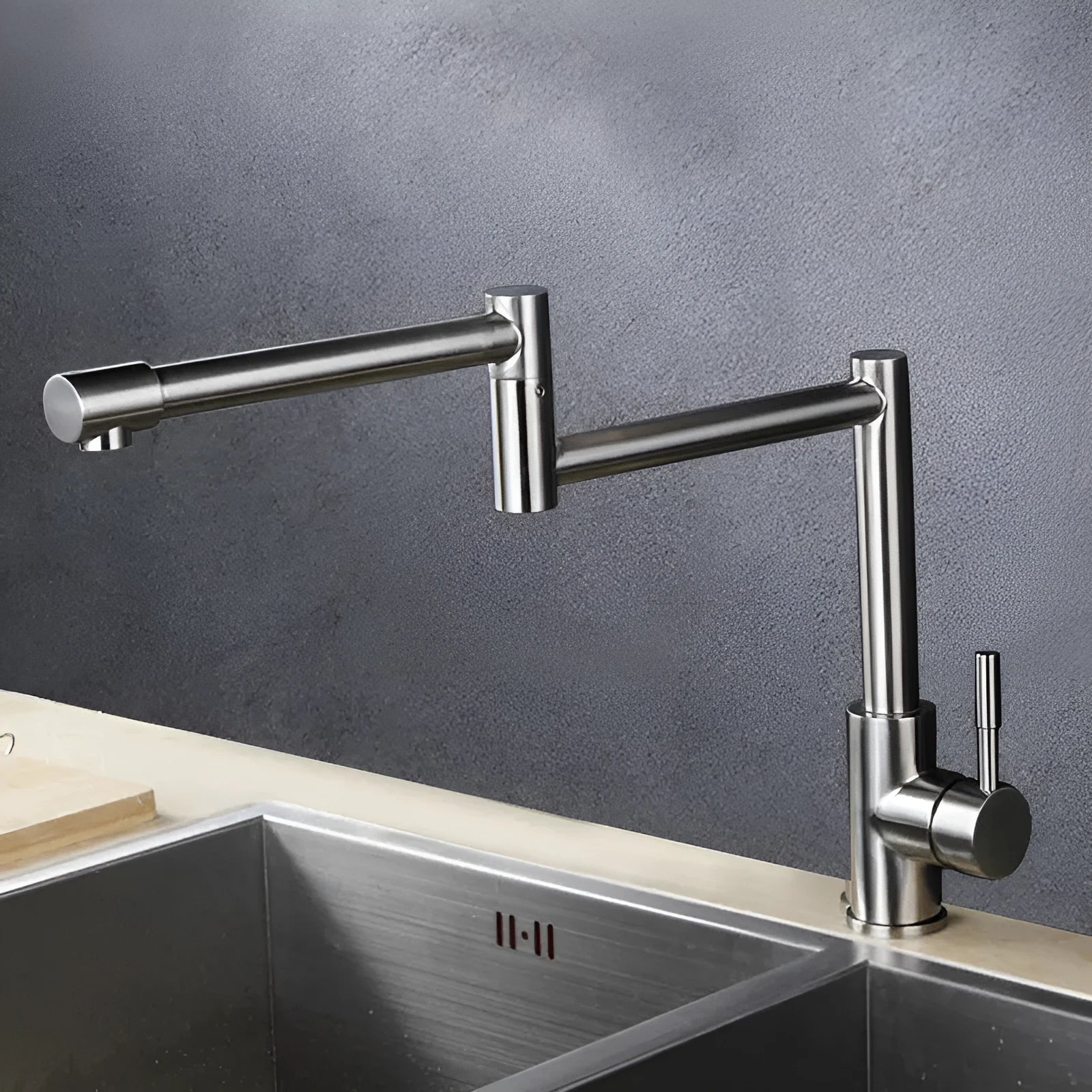 Silver stainless steel mixing tap with rotating spout and lifting handle for dual hot and cold water control