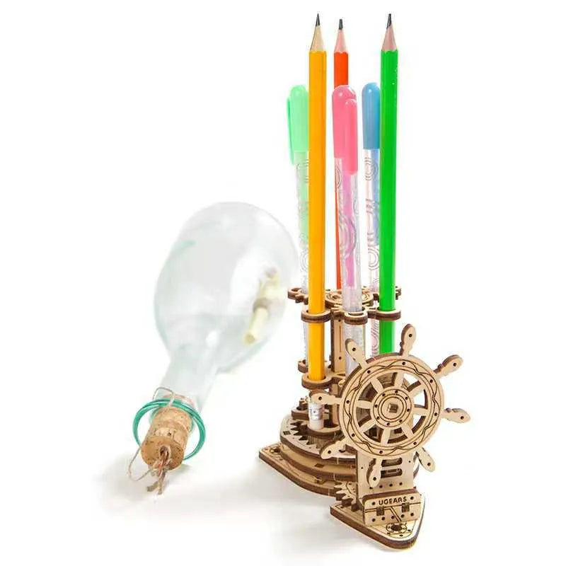 Ukrainian wooden rotating pen holder with steering wheel on a desk.