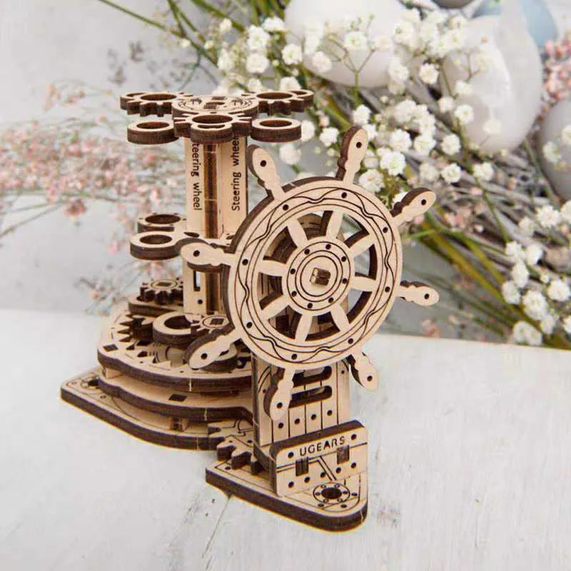 Ukrainian wooden rotating pen holder with steering wheel on a desk.