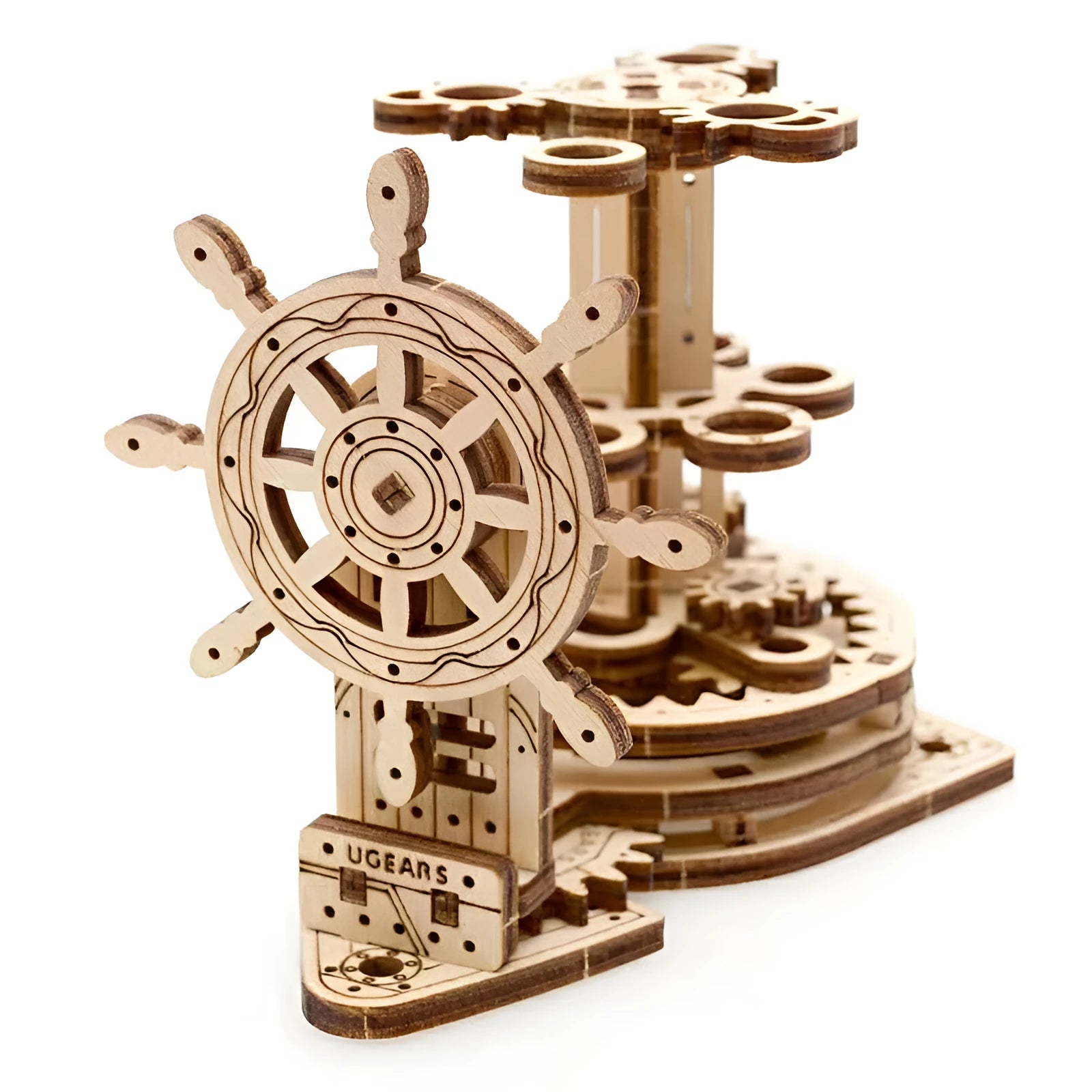 Ukrainian wooden rotating pen holder with steering wheel on a desk.